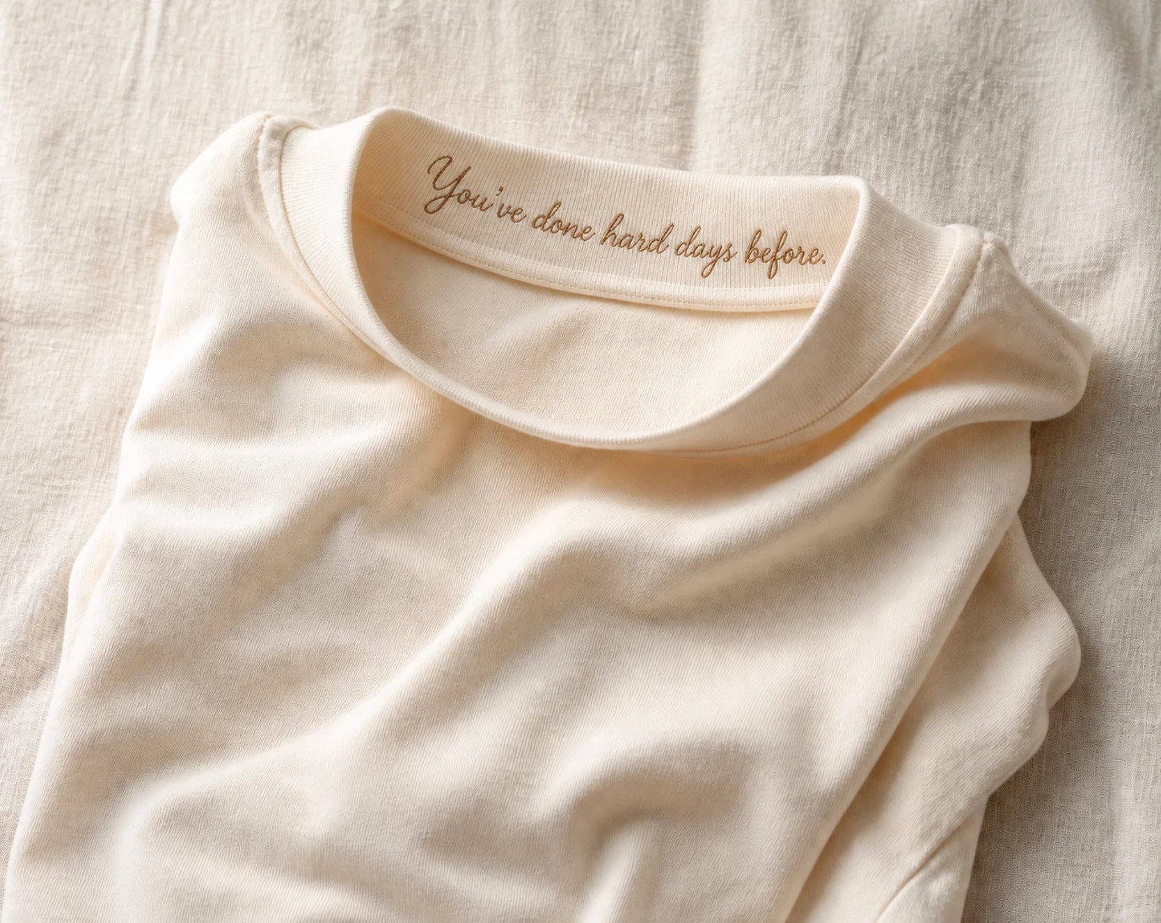 A visualisation of the message embroidered inside the front of the collar
